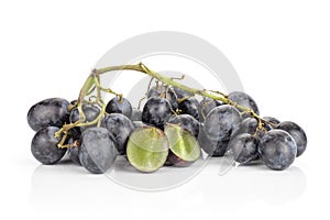 Fresh raw black grape isolated on white