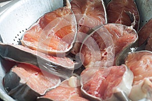 Fresh raw catfish on sieve, close-up