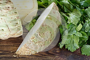 Fresh raw celeriac root head and celery green crisp petiole, ing