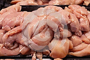 Fresh raw chicken breasts at market
