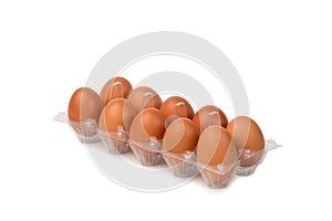 Fresh raw chicken eggs in plastic box on white background