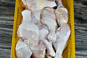 Fresh raw chicken legs drumsticks hindquarter with skin and bones that is ready for baking, grilling, barbecuing, frying or