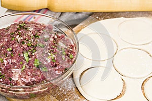 Fresh raw dough and beef forcemeat