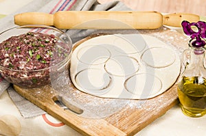 Fresh raw dough and beef forcemeat