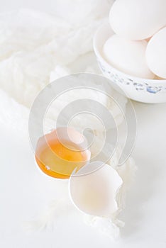 Fresh raw egg bowl on white background. food flat lay on kitchen table