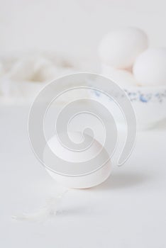 Fresh raw egg bowl on white background. food flat lay on kitchen table