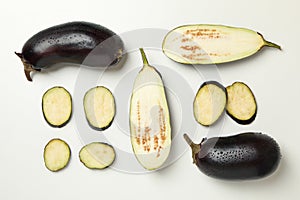 Fresh raw eggplants on white background, top view