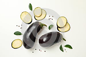 Fresh raw eggplants on white background, top view