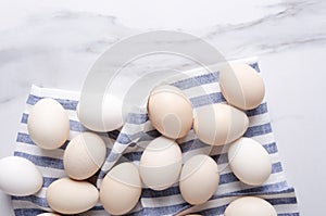 Fresh and raw eggs on the kitchen table before cooking delicious breakfast.Top view and empty space for your text