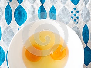 Fresh raw eggs white and yolks.