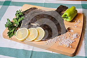 Fresh raw flounder on cutting board