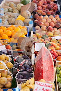 Fresh raw fruits in baskets at street market