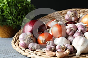 Fresh raw garlic and onions on table, closeup