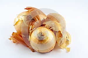 Fresh raw golden onion with onionskin, organic food vegetable, isolated object photo