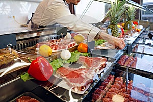 Fresh raw good quality meat on counter in Butcher shop