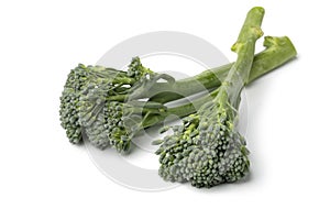 Fresh raw green broccolini close up on white background