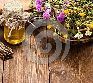 Fresh, raw honey and wild flowers photo