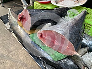 Fresh raw Indo Pacific king mackerels cut into pieces, Spotted mackerels, Seer fishes on the fish market