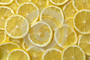 Fresh raw juicy lemon slices full frame close up