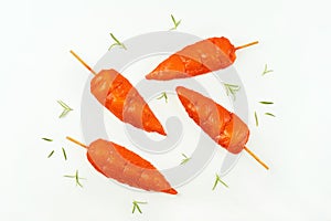 Fresh raw marinated chicken meat skewers iner fillet on a white background.Top view.Copy space.