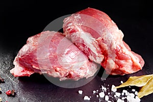 Fresh and raw meat. Cheeks, red pork ready to cook on the grill or barbecue.