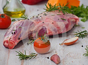 Fresh and raw meat. Leg of lamb on wood background