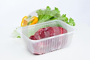 Fresh raw meat and lettuce salad