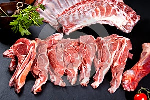Fresh and raw meat. Ribs and pork chops uncooked, ready to grill and barbecue