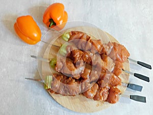 Fresh raw meat skewers kebabs on plate