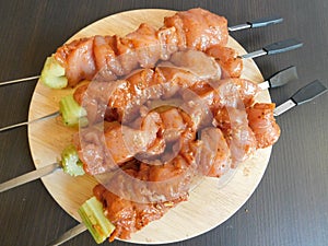 Fresh raw meat skewers kebabs on plate