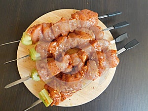 Fresh raw meat skewers kebabs on plate