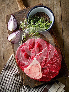 Fresh raw meat on wooden cutting board