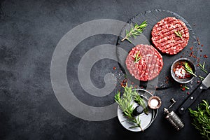 Fresh raw minced beef steak burgers with spices