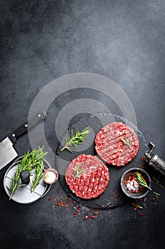 Fresh raw minced beef steak burgers with spices