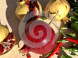Fresh raw pomegranade fruit collected from the three photo
