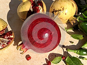 Fresh raw pomegranade fruit collected from the three photo