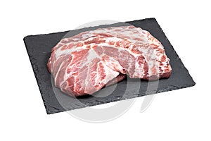 Fresh raw pork meat on a black stone plate