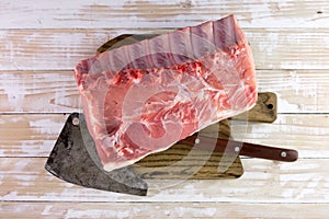 Fresh raw pork piece on wooden board