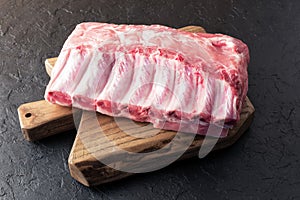 Fresh raw pork piece on wooden board