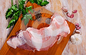 Fresh raw pork secreto fillet and condiments photo