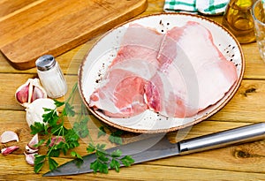 Fresh raw pork secreto steak and spices prepared for cooking photo