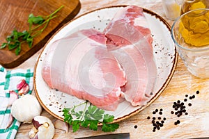 Fresh raw pork secreto steak and spices prepared for cooking photo