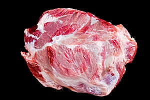 Fresh raw pork shoulder isolated on black background