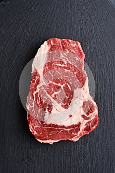 Fresh raw Prime Black Angus beef steak on stone background