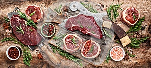 Fresh raw Prime Black Angus beef steaks beef rump steak, Tenderloin fillet mignon served on old meat butcher, banner, menu recipe