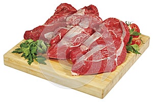 Fresh raw red beef meat big steak chunk on wooden cut board isolated over white background
