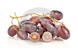 Fresh raw red wine grapes isolated on white