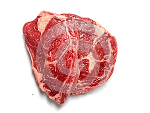 Fresh raw rib eye steak on white isolated surface. Meat industry product. Premium tender meat cut. Top down view