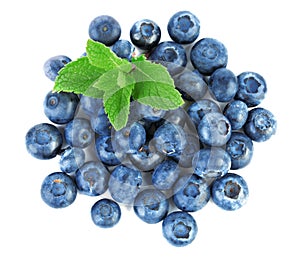 Fresh, raw and ripe bilberries with mint full of vitamins. Healthful and sweet blueberries, isolated on a white background, close-