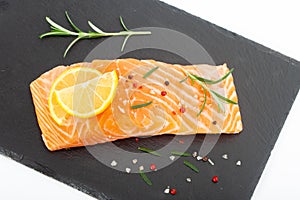 Fresh raw salmon fillet with rosemary and lemon